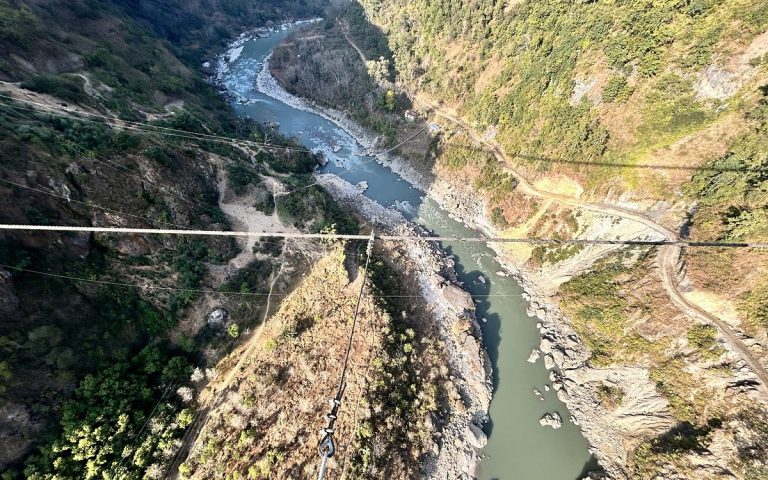 Aerial view of a river winding through a deep valley